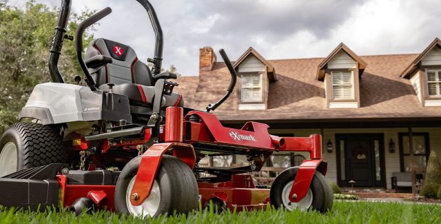 Exmark red lawnmower in front of a home